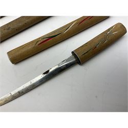 Malayan Kris dagger, the 31.5cm double edged straight heavy damascus blade with copper ferrule; carved hardwood grip; in large wooden throated scabbard with floral decorated white metal covering L47.5cm overall; a kris blade with adapted antler grip; and five various small daggers/letter openers (7)