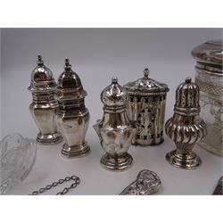 Group of silver, to include Edwardian silver open salt, of circular bellied form, with gadrooned rim, upon three shell feet, hallmarked Mappin & Webb Ltd, London 1906, together with a blank decanter label, repousse decorated with fruiting vines, hallmarked W I Broadway & Co, Birmingham 1995 and five silver pepper shakers, all hallmarked with various dates and makers, etc 