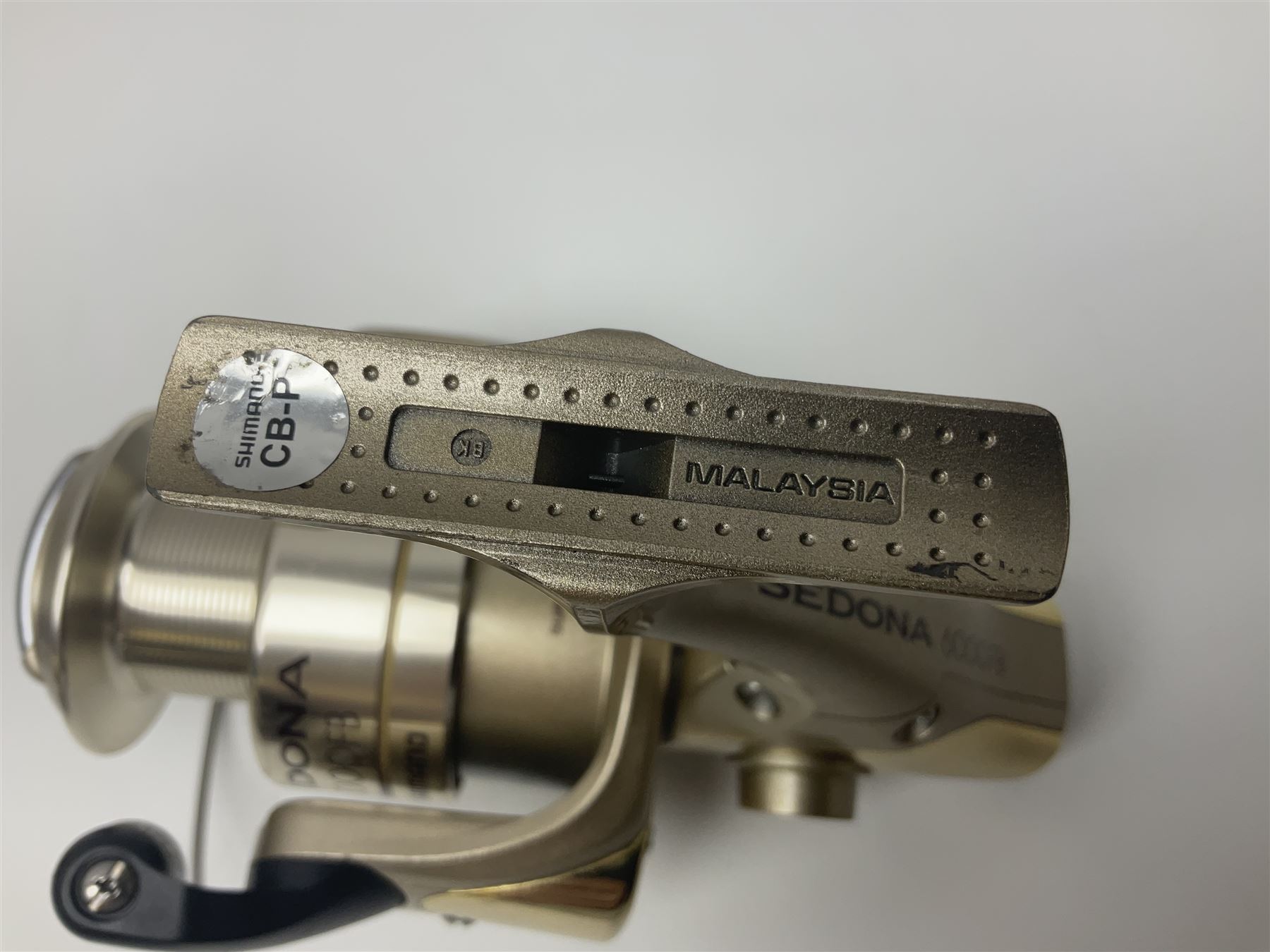 Four fixed spool reels, all in original boxes, comprising Shimano Ultegra 5500 XSD, with spare spool, Mitchell Autosurf 700, with spare spool, Shimano Sedona 600 FB with spare spool and D.A.M Quick 5001