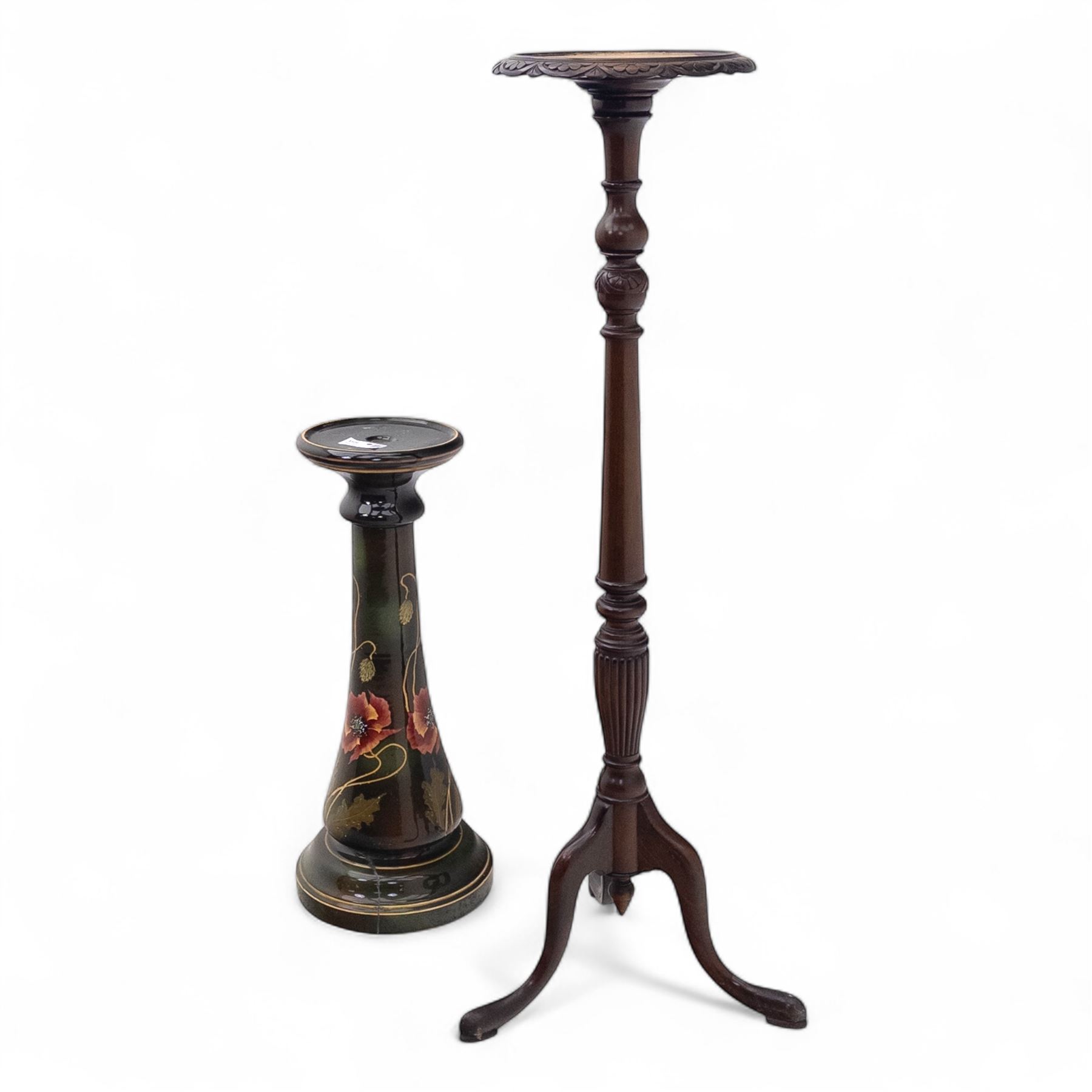 Early 20th century mahogany torchère and ceramic jardinière, circular dished top with carved leaf moulded edge, on ring turned and tapering column raised on tripod splayed supports, together with a hand-painted ceramic jardinière stand decorated with roses on a green ground (Torchère H 122cm, W 31cm, Jardinière H 71cm, W 30cm)