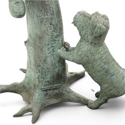 After Eneri Prosperi, bronze garden letterbox, modelled as a seated boy reading on a tree stump, with rustic post box with mail indicator, dog at his feet, textured verdigris finish throughout