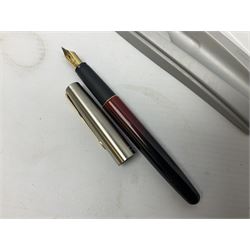 1950s Parker 51 Aerometric pen with rolled gold cap and dove grey case, Yard O Led rolled gold mechanical pencil, Parker Frontier fountain pen in merging red and black, Parker gold nib pen in dark blue case, and eleven other vintage pens
