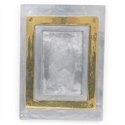 David Marshall photo frame, of cast aluminium mounted with a smaller brass frame, the maker's mark impressed to the lower left hand corner, H23cm