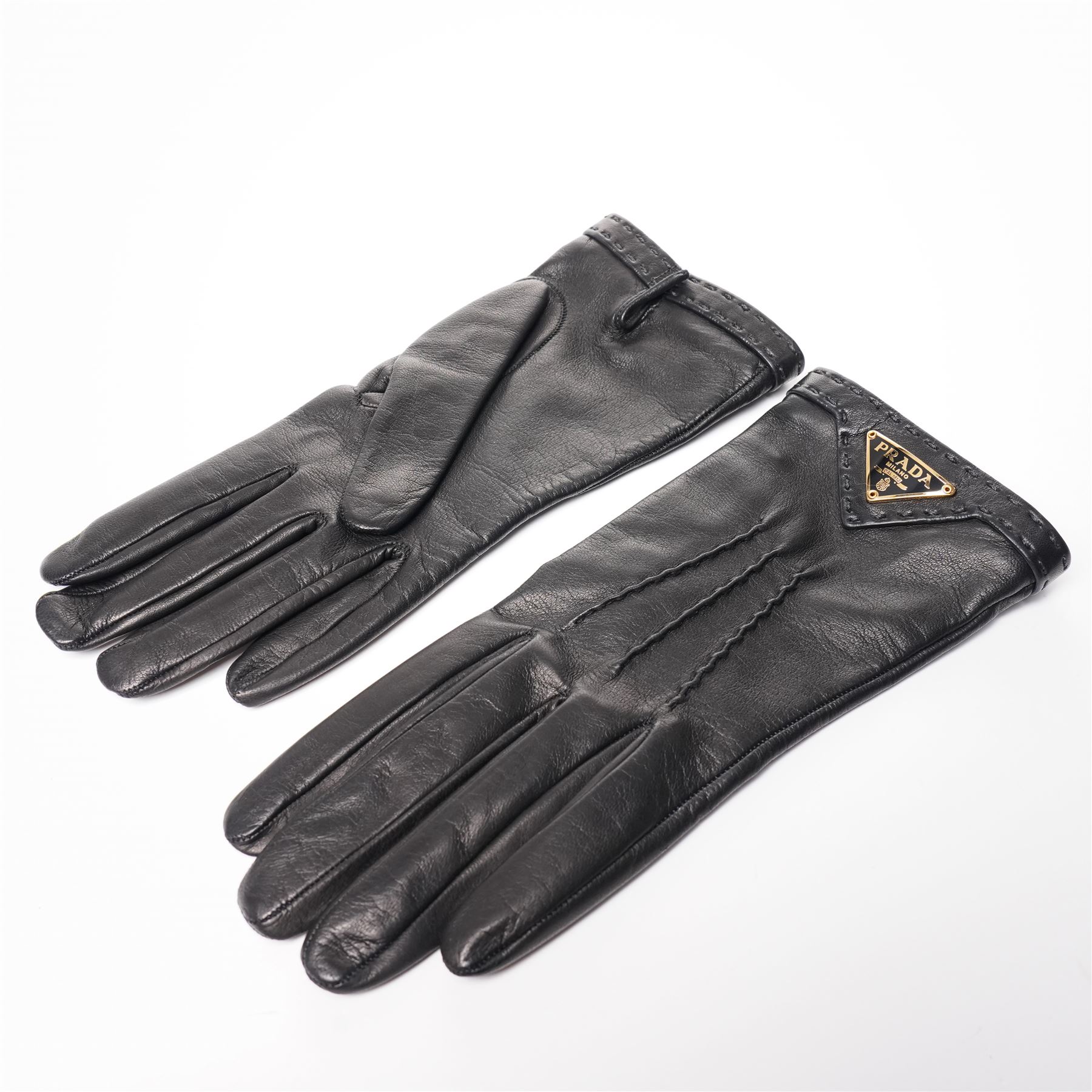 Prada - pair of black lambskin leather gloves, with enamel gold-tone and black triangle logos and silk lined interior, unused with original box
