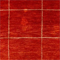 Two contemporary Moroccan Berber hand-woven rugs, deep madder red field of plain design, 199x153cm, other with deep madder red field with a simple lattice of ivory lines forming panels with some tonal variation, 190x146cm 