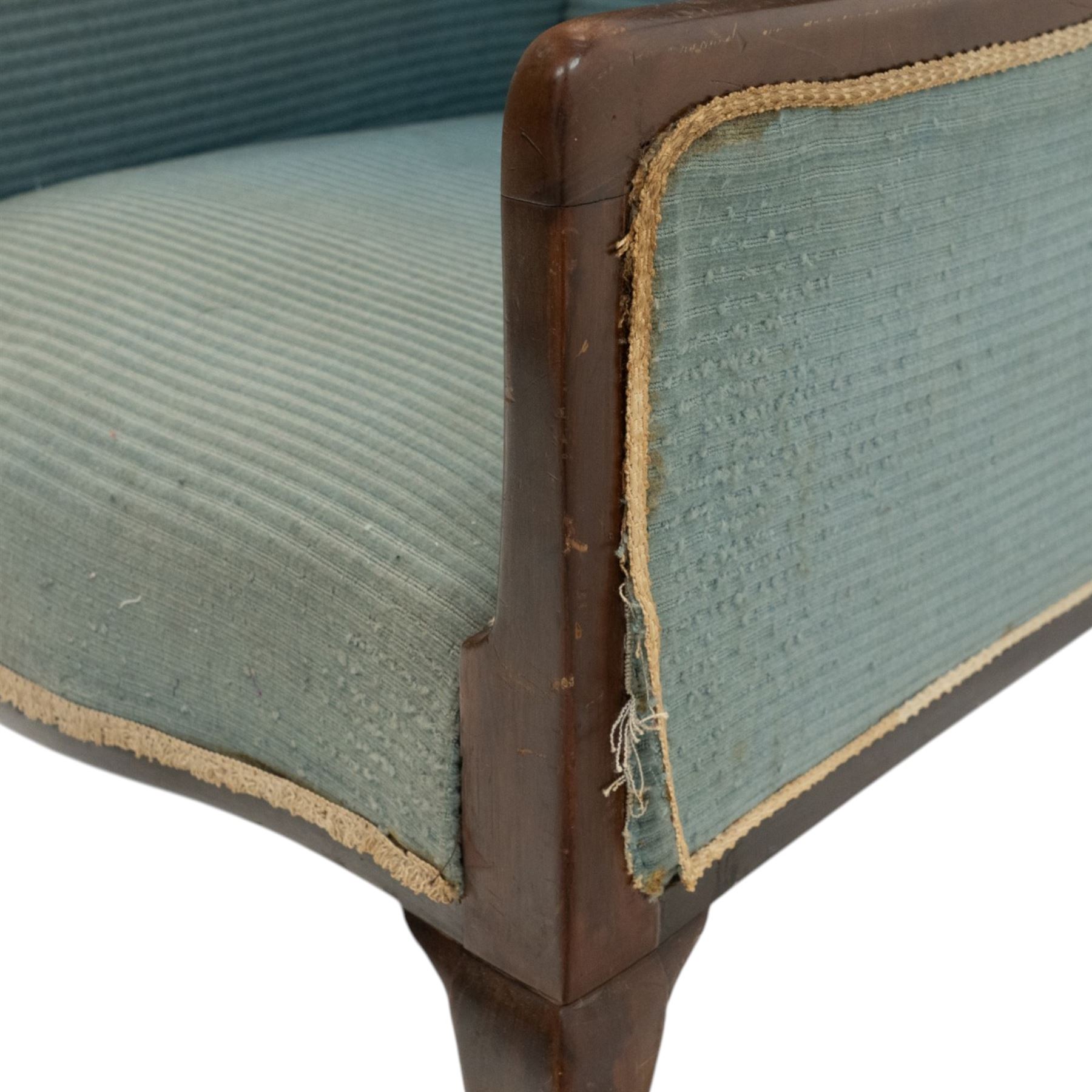 Edwardian armchair of squared form upholstered in blue fabric, serpentine seat front, shaped frame raised on cabriole supports