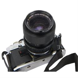 Olympus OM10 camera body serial no. 2279129, together with an Olympus OM-System S Zuiko Auto-Zoom 35-70mm 1:4 lens serial no. 283352, a Paragon 1:5.6 f=300mm 62 lens serial no. 12053, Hoya HMC Tele-Auto f-135mm 1:2.8 52 lens serial no. 638199, Tokina SD 70-210mm 1:4-5.6 52 serial no. 8844630, Olympus OM winder 2, Colly miniature/spy camera and other accessories in a Fotima carry case