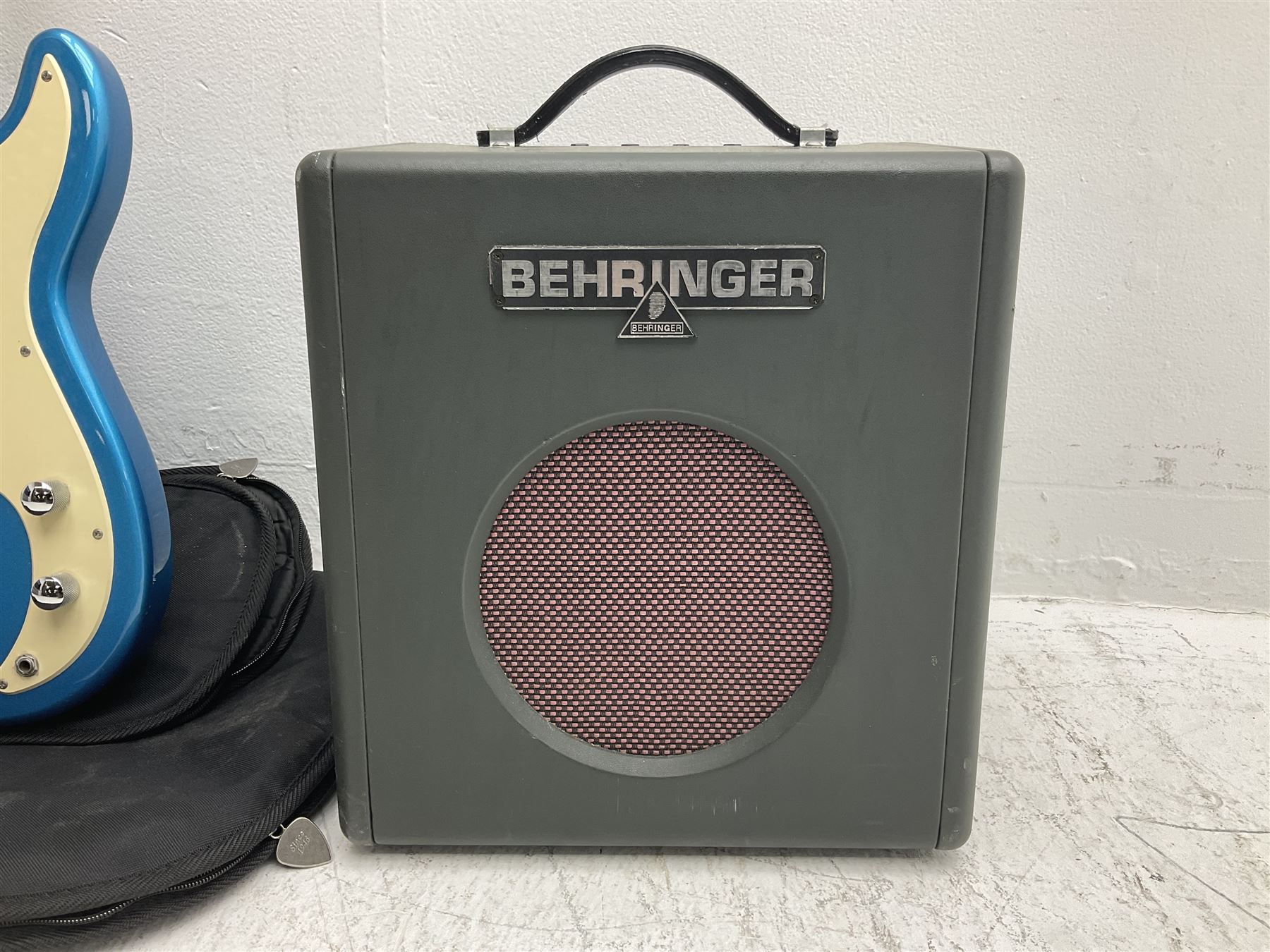 Richwood electric bass guitar in blue, cream and natural finish L117cm; in Fender soft carrying case; together with Behringer Thunderbird Bx108 amplifier date code 0 4 11.