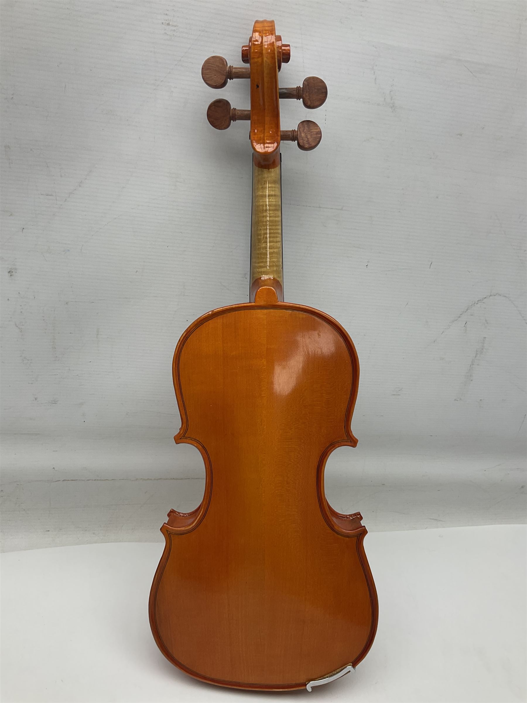 Three Stentor Student violins - three-quarter size with 33cm two-piece back; and two quarter size each with 28cm two-piece back; each in carrying case with bow (3)
