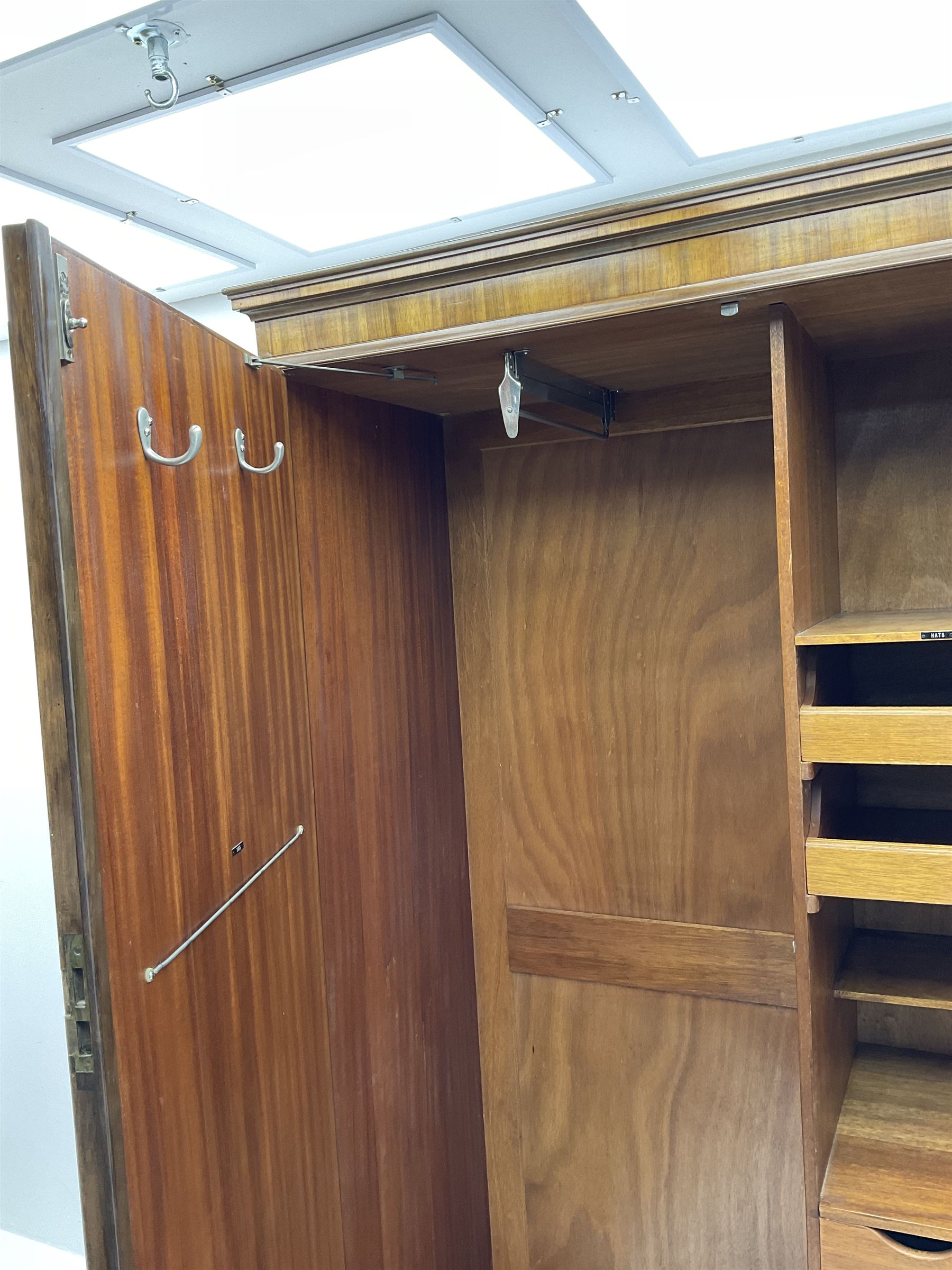 Waring and Gillow - early to mid 20th century figured walnut Gentleman’s wardrobe, two doors enclosing various compartment, mirror, drawers and hanging space, labelled 