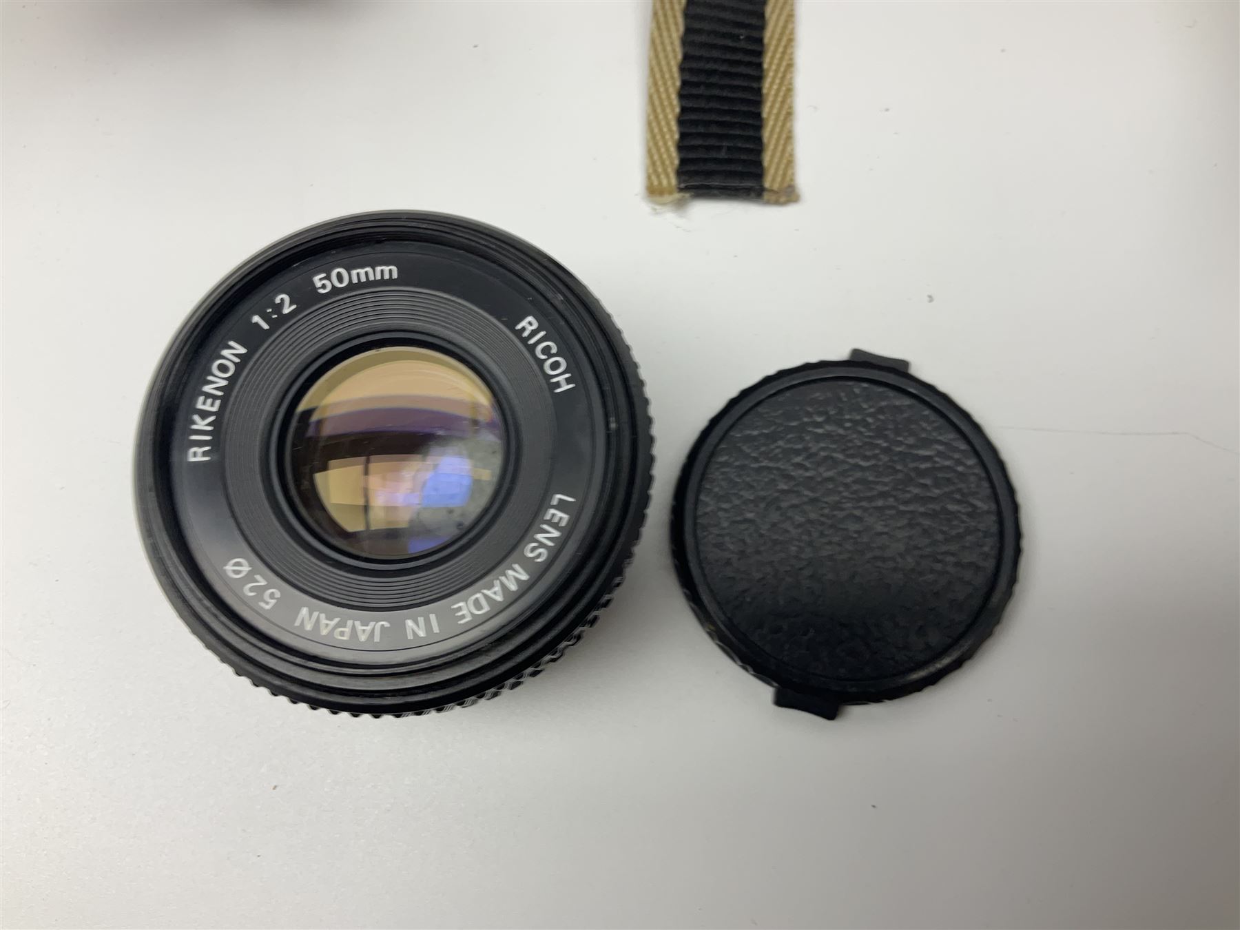 Four camera bodies, to include, Ricoh KR-10 serial no. 38826, Pentax MZ-M serial no. 4185969 with 'SMC Pentax- M 1:3.5 28mm' lens, Canon EOS500 serial no. 080927, with 'Sigma Zoom 100-300mm 1:4.5-6.7 DL'  lens etc, with other camera lenses and equipment 