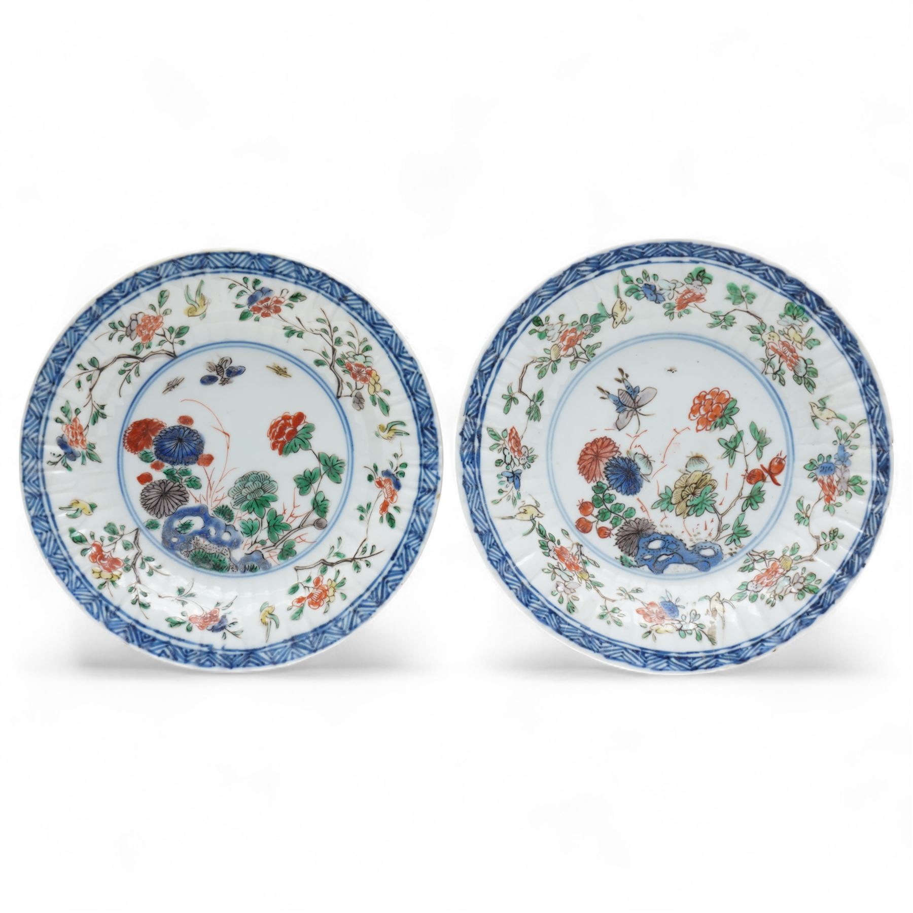 Two Chinese Kangxi period famille verte cafe au lait saucers, decorated with native animals among foliage, with indistinct mark within double rings beneath, D14cm 