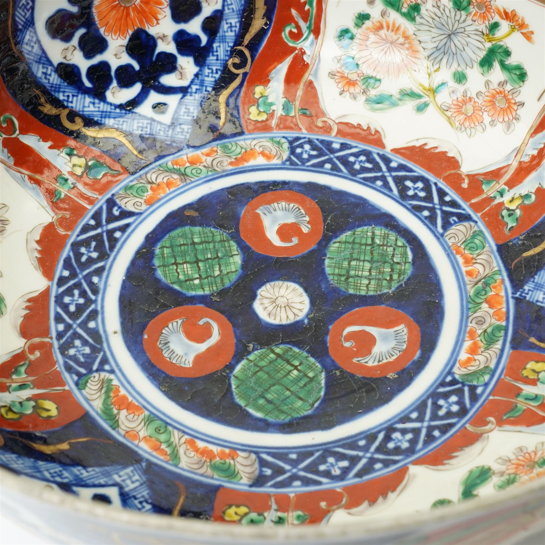 Late 19th/Early 20th century Japanese Imari bowl decorated with panels of flowers in blue, orange and green etc D27cm, Imari vase H24cm and a small ginger jar (3)