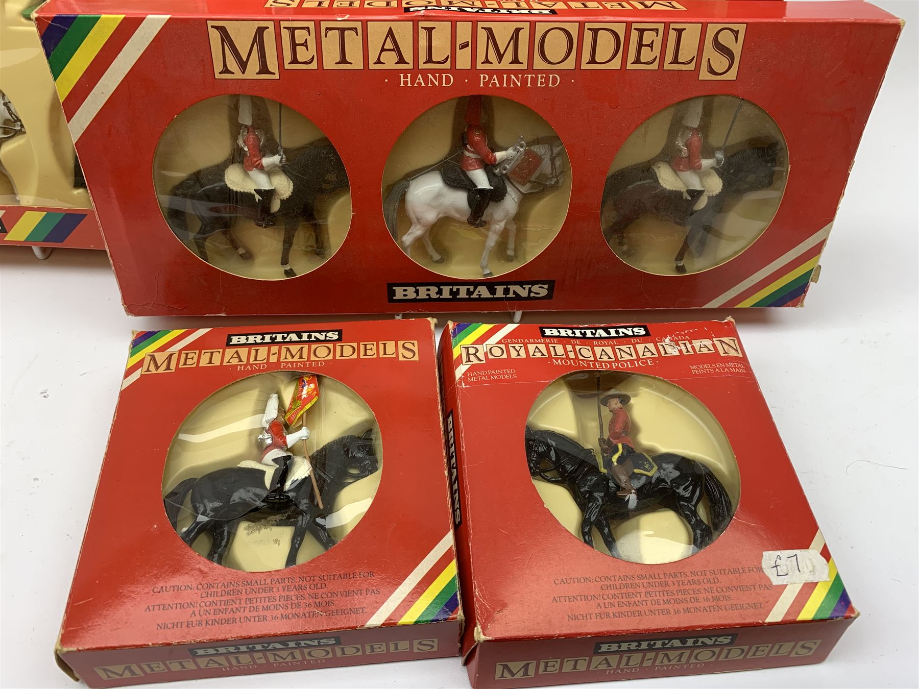Britains 'Metal-Models' series - nine sets/mounted soldiers comprising 7218 H.M. Queen Elizabeth set, 7233 H.M. Queen Elizabeth set, 7305 U.S. Marine Corps set, 7205 Three Mounted Life Guards, 7201 Royal Marine Colour Party, 7203 Royal Marine Drum & Bugle, 7249 Queens Colour Party, 7246 Lifeguard Standard Bearer and 7234 Royal Canadian Mounted Police; all boxed (9)
