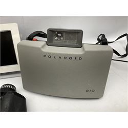 Olympus Fe-5035 digital camera, together with a Polaroid camera, Philips digital photo frame etc
