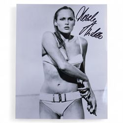 Eight James Bond signed 10 x 8