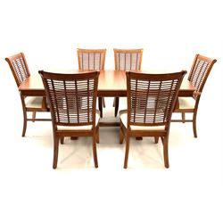 Cherry wood extending dining table, rattan woven supports raised on shaped feet (L208cm, W107cm, H75cm), along with six chairs (4+2), (W57cm)