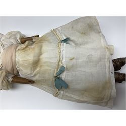 Victorian wax shoulder head doll with pale complexion, applied hair, inset glass eyes and fabric covered jointed body with kid leather lower arms; white linen dress and undergarments H50cm