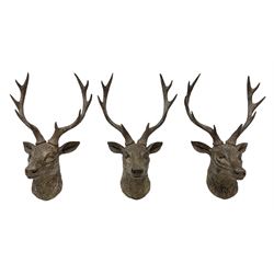Three composite wall mounted stag heads with antlers, H47cm