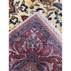 Persian Mahal rug, ivory ground field decorated with floral medallion and interlaced foliate, decorated all over with stylised flower and plant motifs, scrolled repeating triple band border