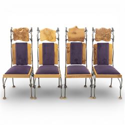 Paul Hodgkiss Designs of Glasgow - contemporary shaped elm dining table with wrought iron base; with set ten (8+2) matching high-back dining chairs, table of organic form above an elaborate wrought iron supports, with central elm stretcher, the chairs with en suite with matching wrought iron work burred elm headrest, purple velour upholstery with drop in seat     

Table: W 102cm, L 243cm, H 74cm
Chairs: W 56cm, D 52cm, H 130cm