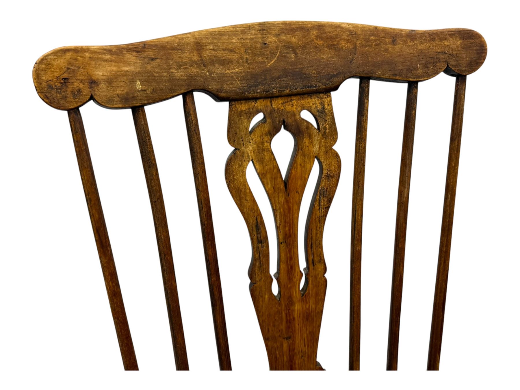 19th century provincial elm and beech Windsor armchair, shaped cresting rail over stick back with pierced and shaped splat, the dished seat on turned supports united by turned stretchers 