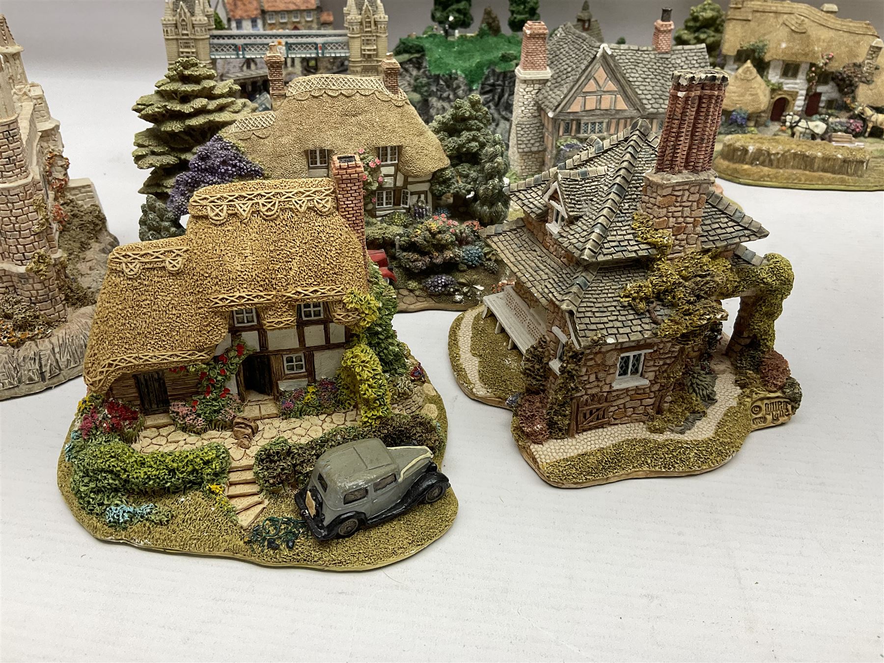 Twenty six Lilliput Lane models, to include Golden Harvest, Junk and Disorderley, Heaven Lea Cottage, Old Scrumpy Farm, Chantry Chapel Wakefield, etc, together with four similar cottages