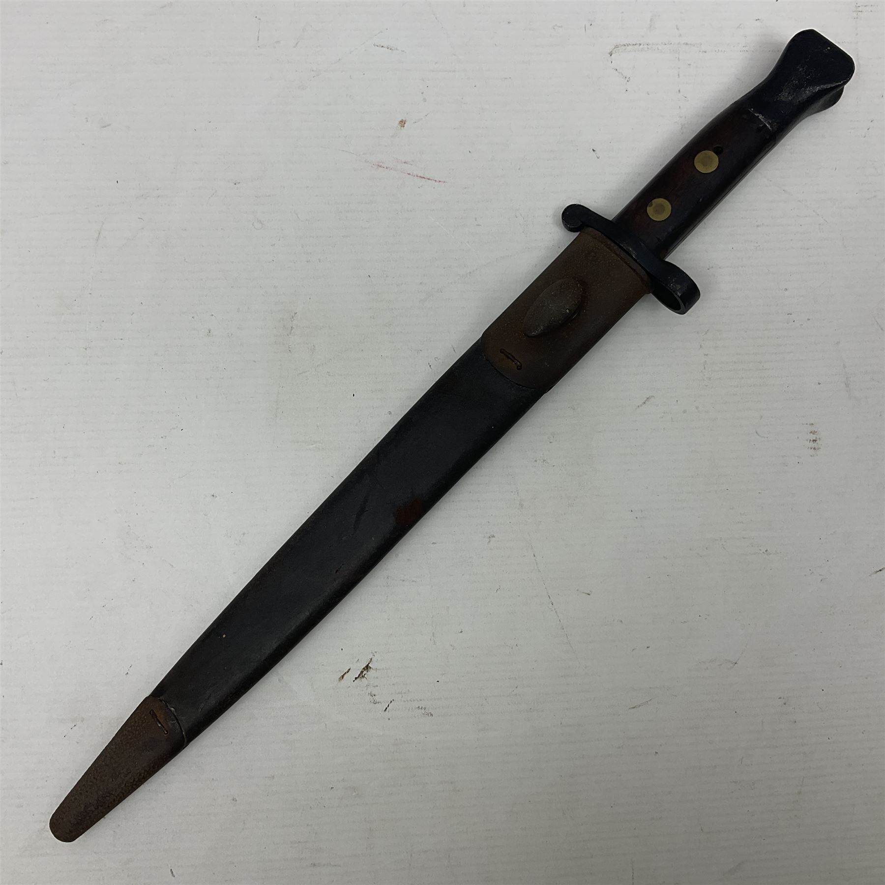 British Pattern 1888 knife bayonet, the 30cm double edged blade by Sanderson with central raised medial ridge and various marks to the ricasso including date code 12 98; in leather covered scabbard with various stamped marks L44cm overall