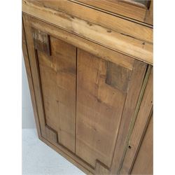 Large late 19th century sycamore corner cabinet, the top section with two astragal glazed doors enclosing two shaped shelves, the lower section enclosed by two panelled doors with square spandrels, W128cm, H215cm