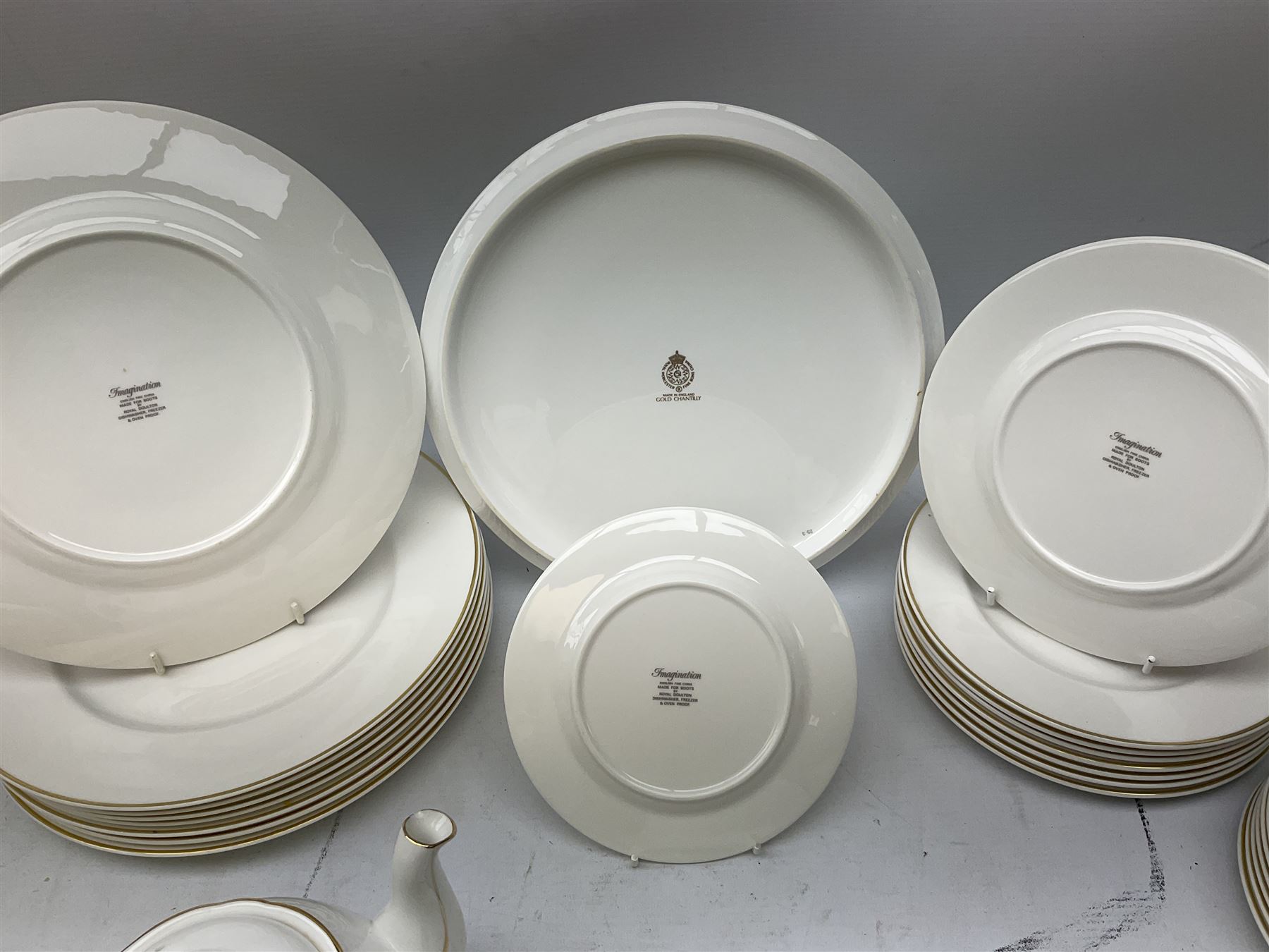 Royal Doulton Imagination pattern part dinner service, comprising eight dinner plates, eight side plates, eight dessert plates, eight bowls and nine cups and saucers, together with Royal Doulton Fortune pattern, five covered tureens,  jug and stand and other similar