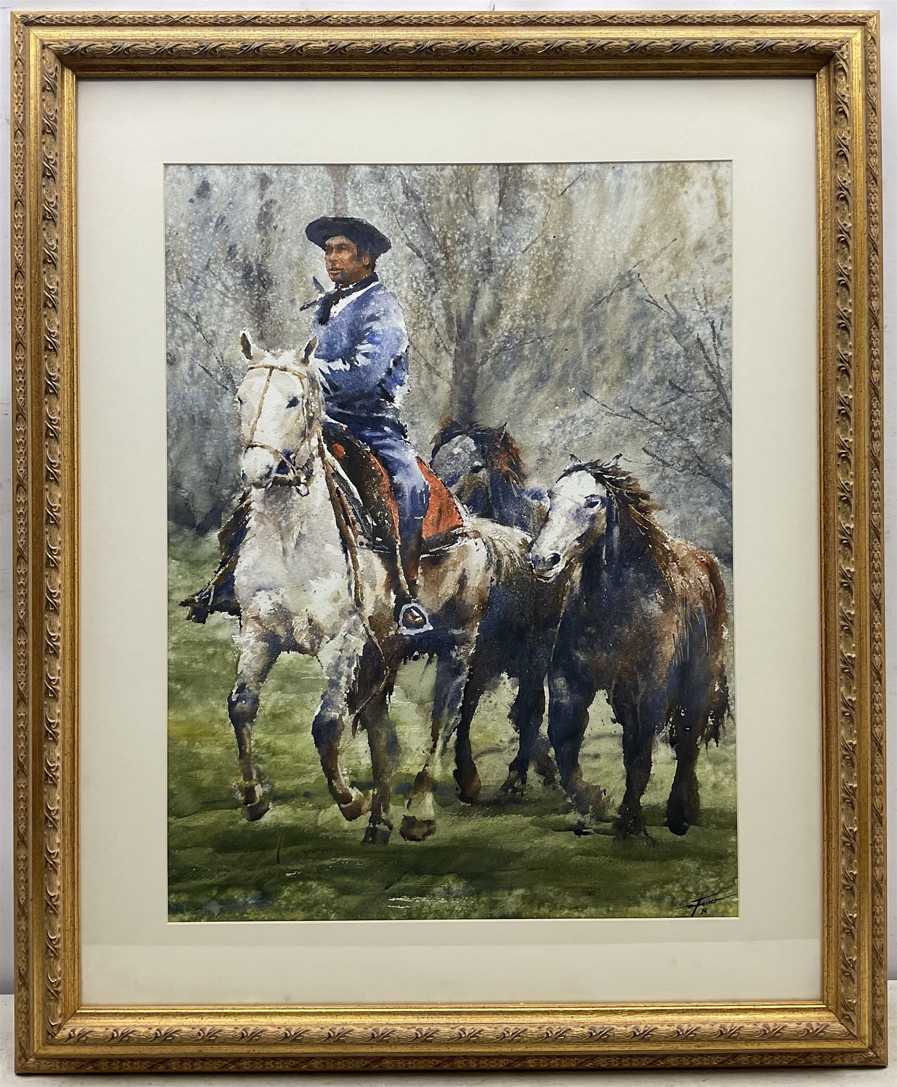 Diego Ferrer (Argentinian Contemporary):  Gaucho and Three Horses, watercolour signed and dated '24, 67cm x 50cm