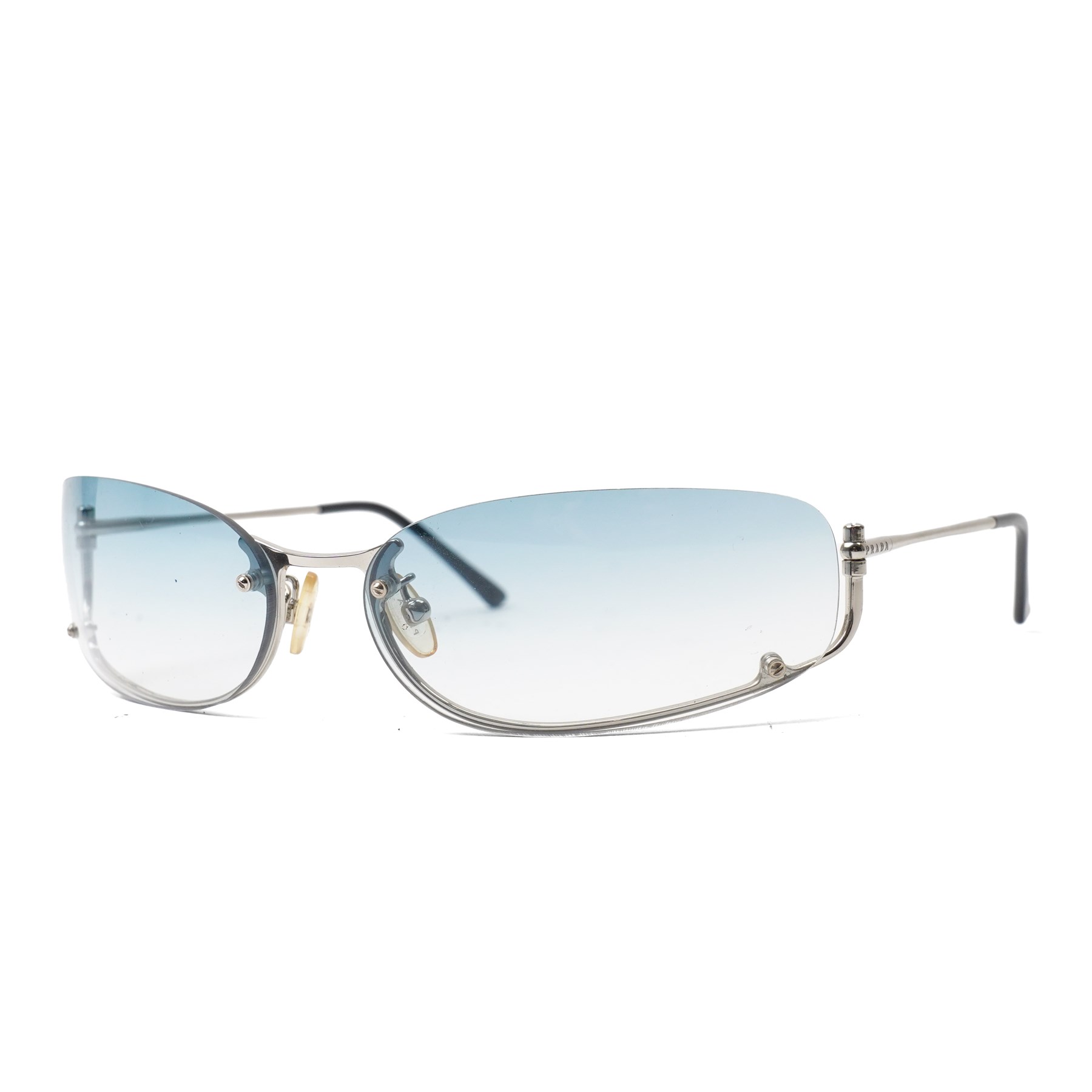 Prada - rimless shield-style sunglasses, with graduated blue smoke lenses, silver-tone metal lower bridge and temples and PRADA lettering to the arms, in original hard case 