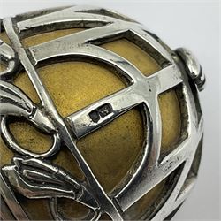 Modern silver limited edition Easter egg, no. 70/500, the gilded body decorated in relief with silver latticework and a band of flower heads, the detachable cover opening to reveal a gilt interior, each hallmarked St James House Company, London 1978, H5.5cm