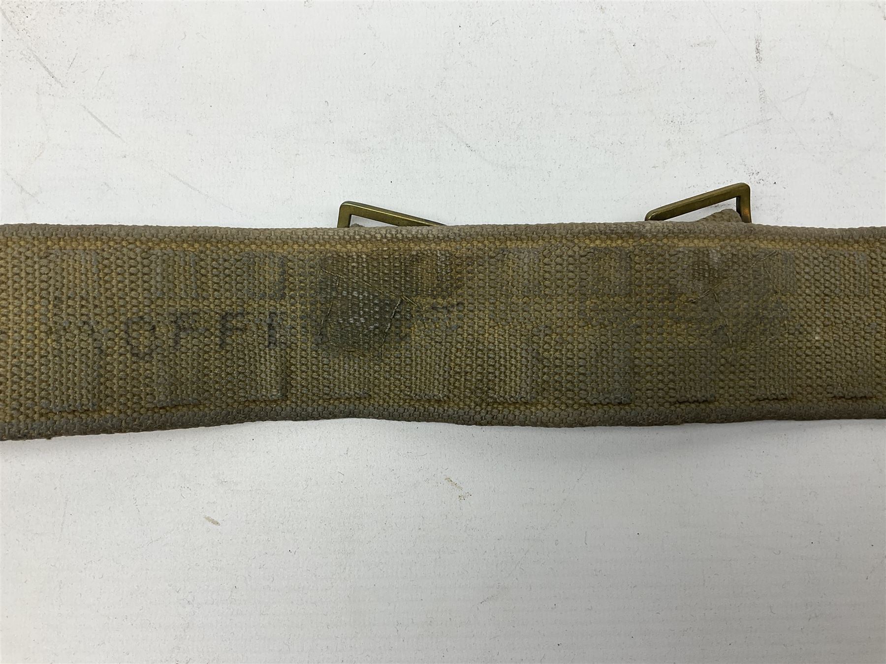 WW2 British black felt beret with Pioneer Corps cap badge, with Kangol Wear maker's mark dated 1943; and a British Army green webbing belt (2)