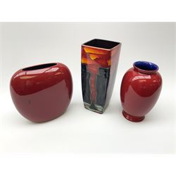 A Poole Pottery vase, of ovoid form decorated with green and yellow forms upon a red glazed ground, H20cm, together with two Anita Harris Art Pottery vase, with similar decoration. 