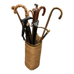 Walking sticks, hunting crop with silver collar, etc with stand