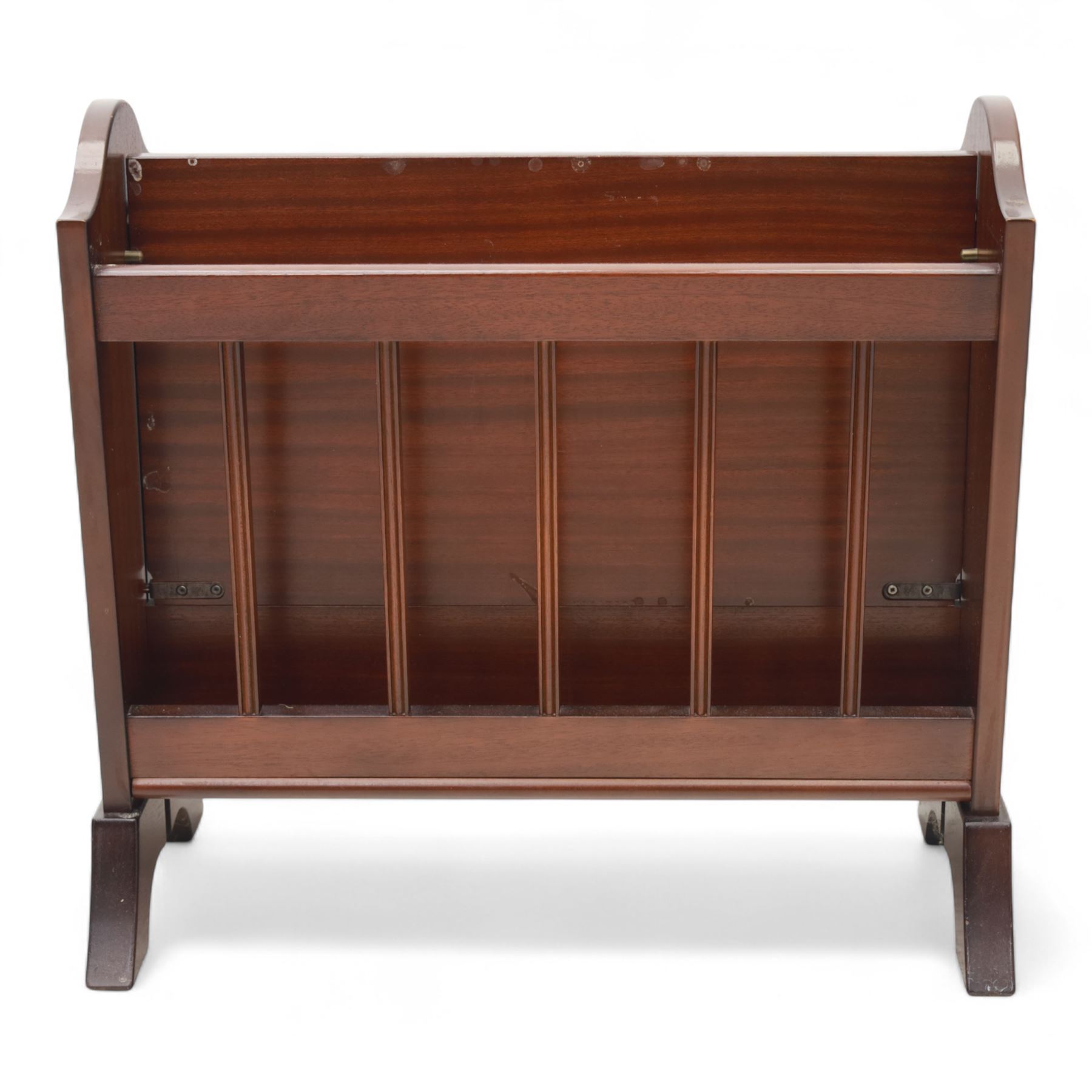 20th century mahogany magazine rack, with shaped ends and pierced divider slats, brass lion mask ring handles to each side, raised on splayed bracket feet