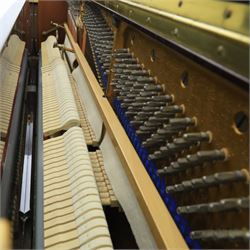 Bluthner of Leipzig upright piano, mahogany case with 88 keys and three brass pedals