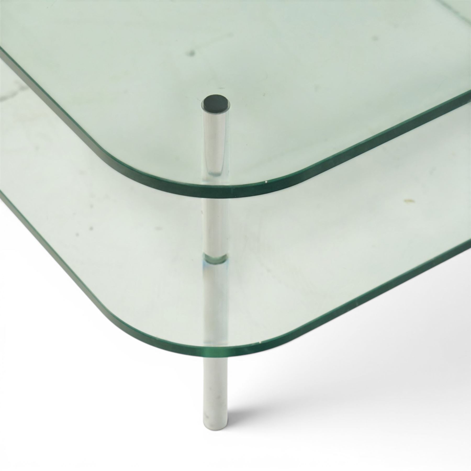 Contemporary glass coffee table with chrome supports