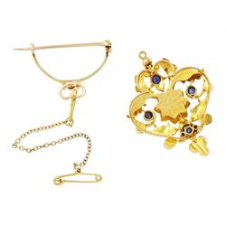 Victorian 15ct gold sapphire and split pearl pendant / brooch, the central flower head cluster set with a round cut sapphire surrounded by pearls, amongst an openwork setting set with four further sapphires and pearls, the reverse with presentation engraving and detachable brooch setting