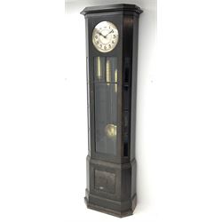 Early 20th century oak longcase clock, canted case with projecting cornice, the door glazed with concave dial glass and astragal panelling, panelled base, silvered Arabic dial triple weight driven movement chiming the quarters on rods, Westminster chime