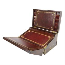 19th century brass bound mahogany writing slope with twin drop carry handles to sides, the hinged cover opening to reveal a  gilt tooled burgundy leather slope and compartmented interior, H22xm W50.5cm D30cm