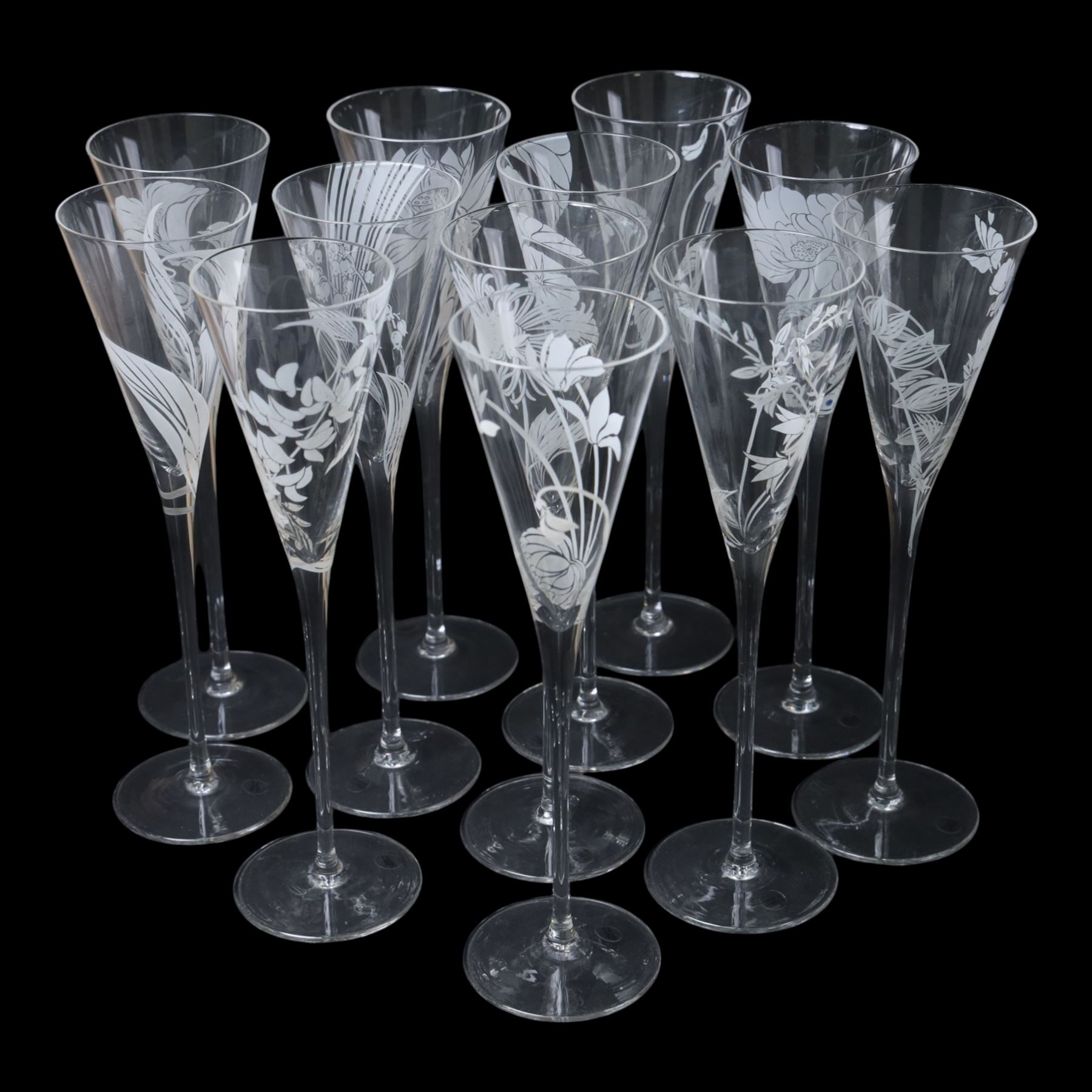Twelve Crystal champagne glasses Les Fleurs, issued by the Franklin Mint in collaboration with Perrier Jouet, each glass is etched with a different flower, all boxed 
