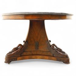 French mid-19th-century Second-Empire mahogany centre table with a dished grey-veined marble top, on a tapered triform pedestal with anthemion brass mounts above carved recumbent swan figures with delicately refined wings and graceful necks curving backwards, associated with the Empress Josephine, raised on three small platform bases