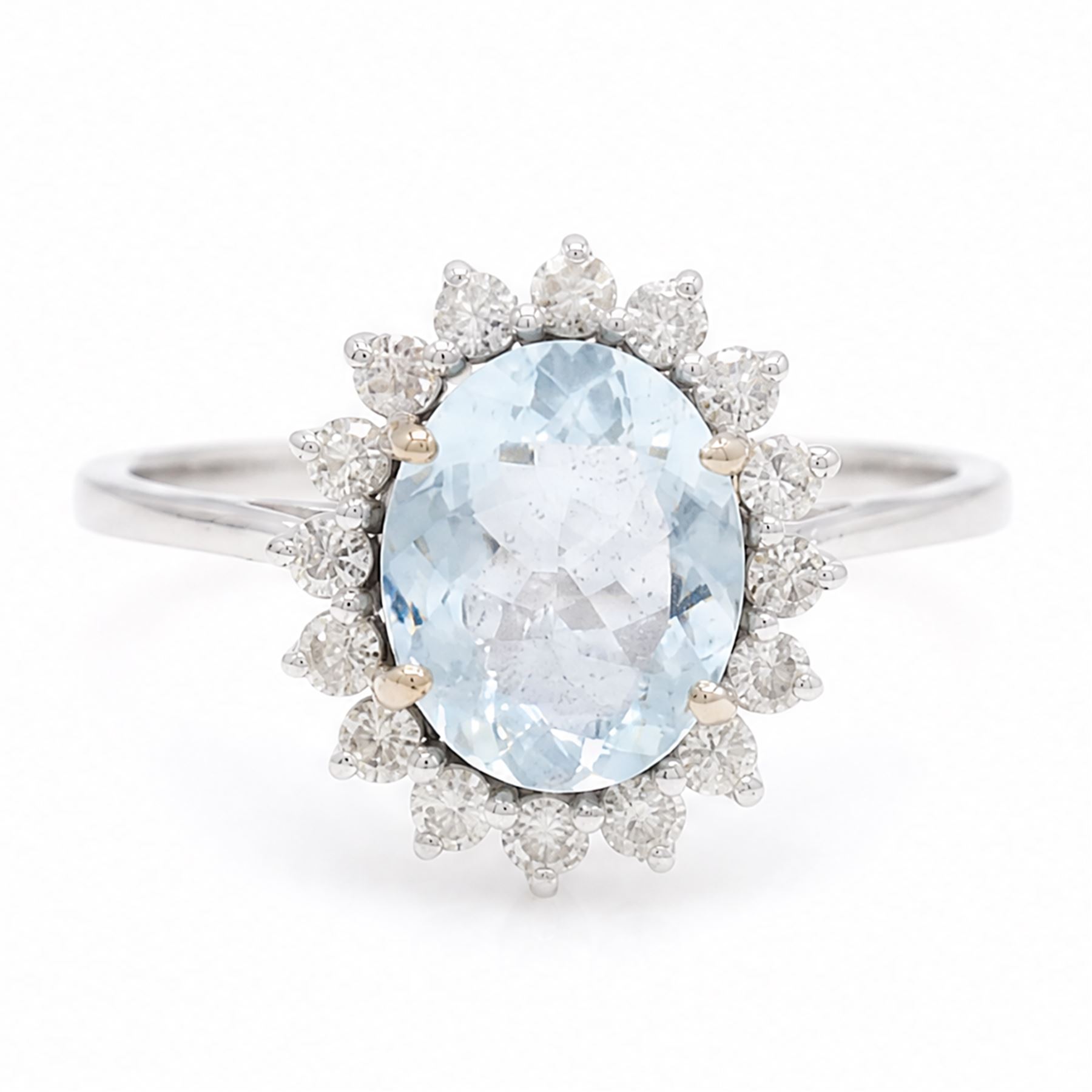 18ct white gold aquamarine and diamond cluster ring, single oval cut aquamarine of approx 2.05 carat, surrounded by sixteen round brilliant cut diamonds, stamped 18K, total diamond weight approx 0.50 carat