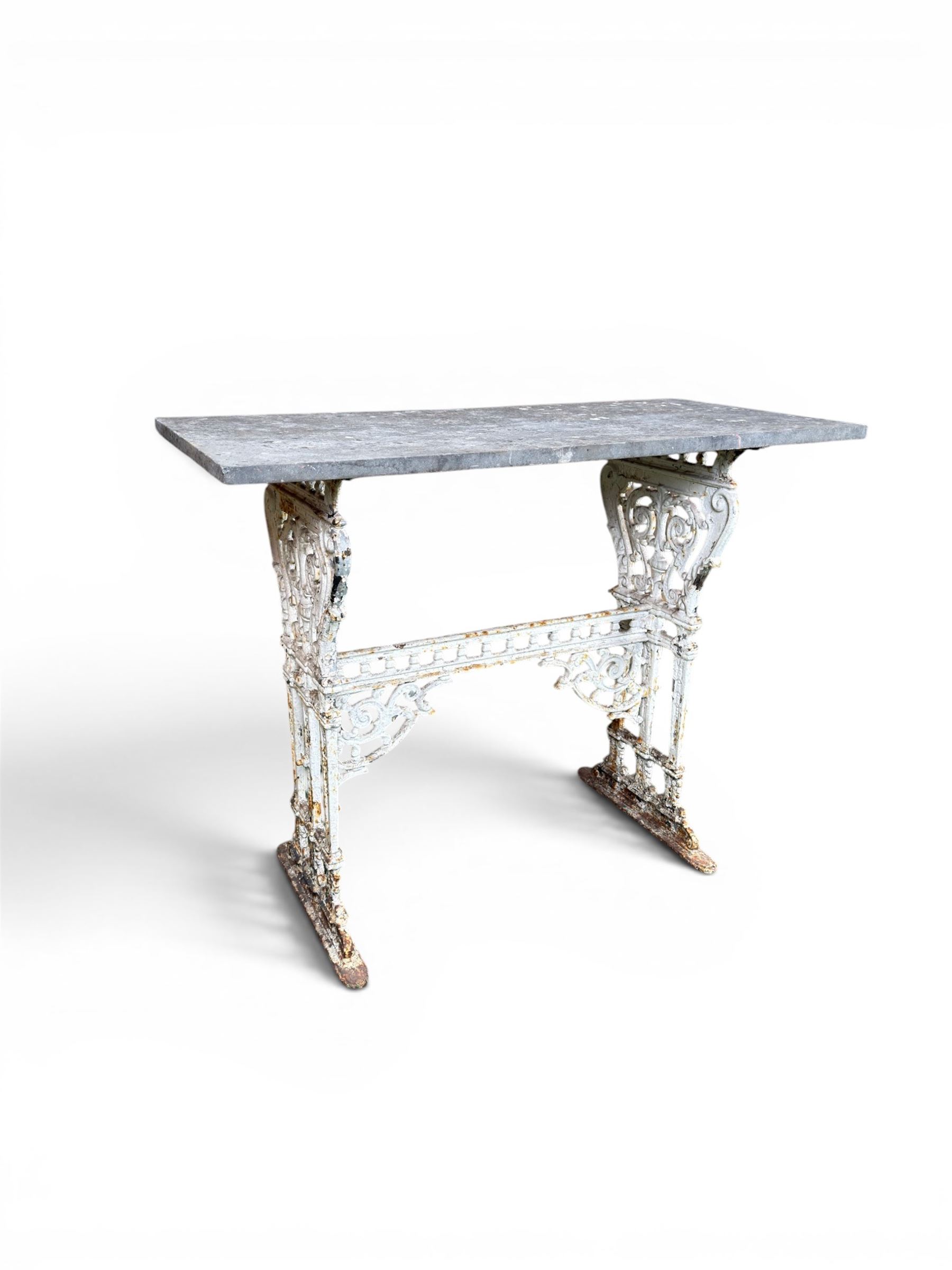 Victorian ornate cast iron garden table, trefoil base with central enclosed column, circular top with later marble, with registration mark