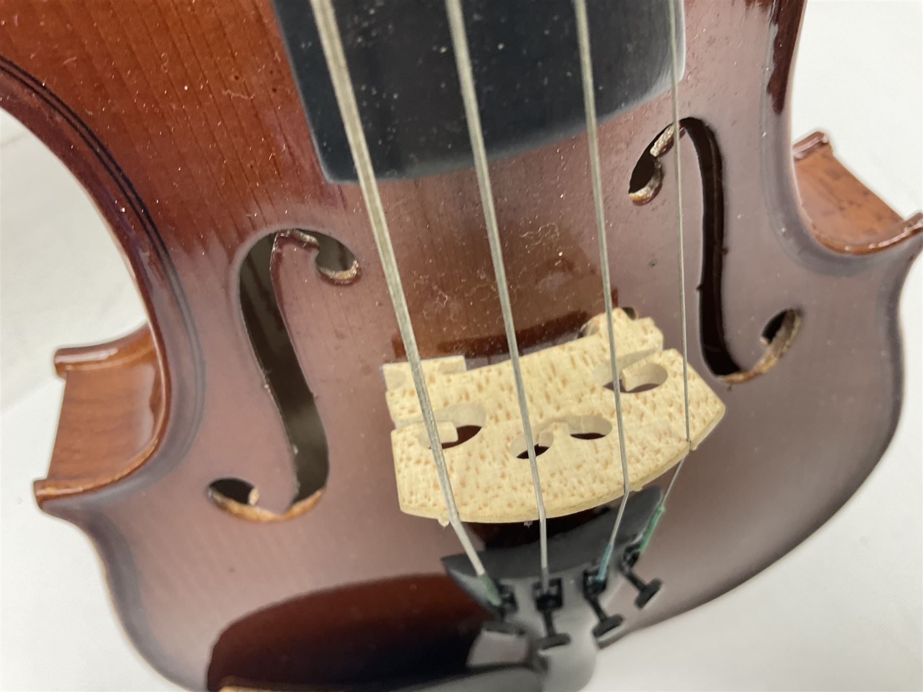Four student violins - two Chinese three-quarter size with 33.5cm and 34cm two-piece backs; Stringers of Edinburgh quarter size with 28cm two-piece back; and Stentor quarter size with 28cm two-piece back; each in carrying case (4)
