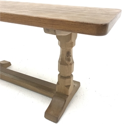 'Mouseman' adzed Yorkshire oak coffee table, rectangular top raised on octagonal supports with sledge feet, united by floor stretcher, by Robert Thompson of Kilburn, 91cm x 38cm, H45cm