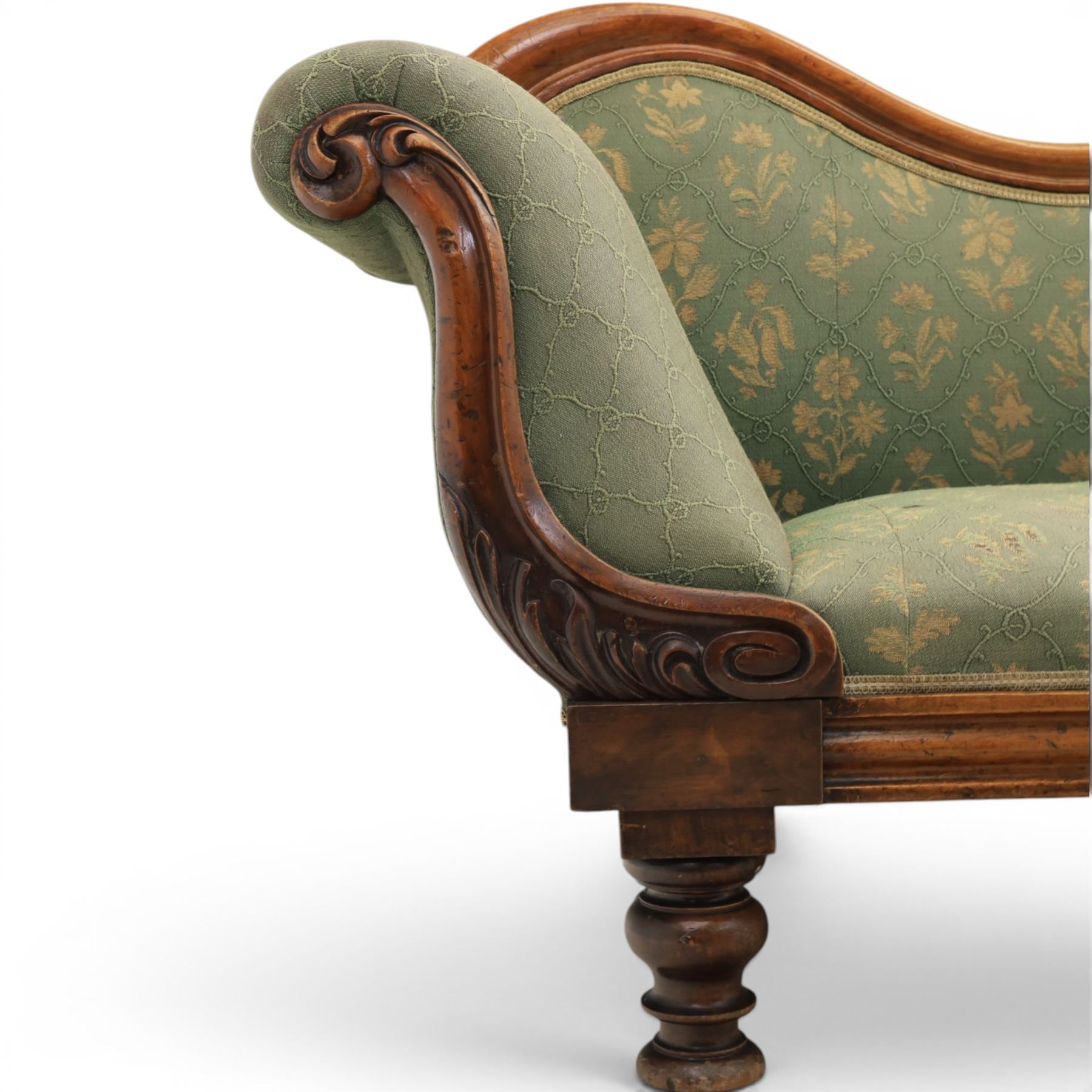 Victorian mahogany framed sofa, scroll arms with double camel back, green geometric upholstery, raised on turned supports