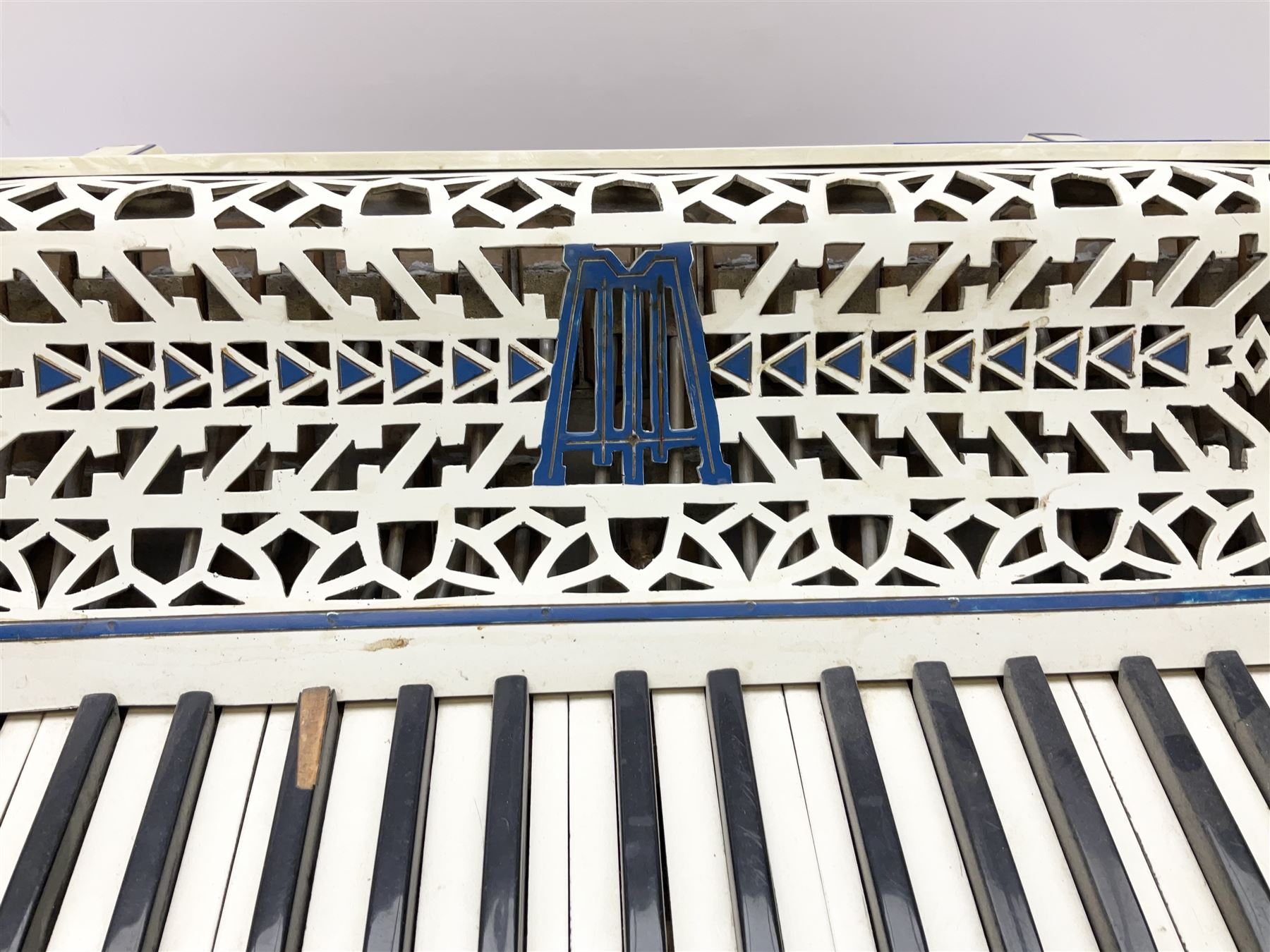 Italian Lambardi piano accordion in ivory coloured pearline case with jewelled decoration, twenty keys and one-hundred and twenty buttons L 37cm